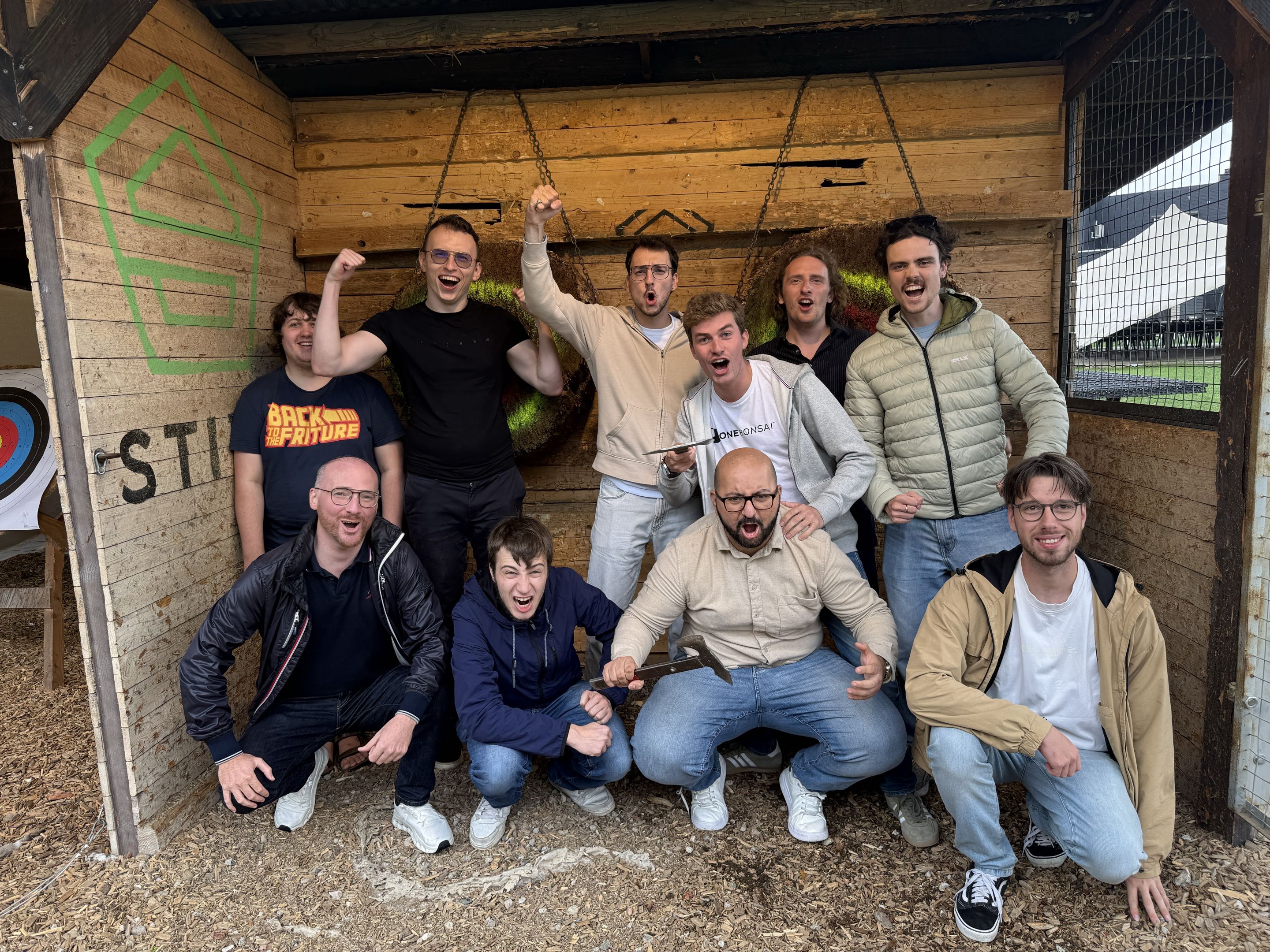 The OneBonsai team celebrating together at an outdoor team activity